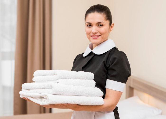 chambermaid-preparing-hotel-room